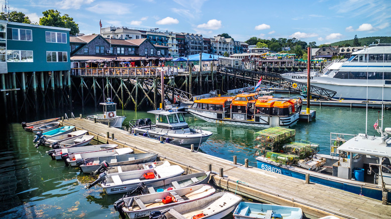 Large and small boats docked near buildings