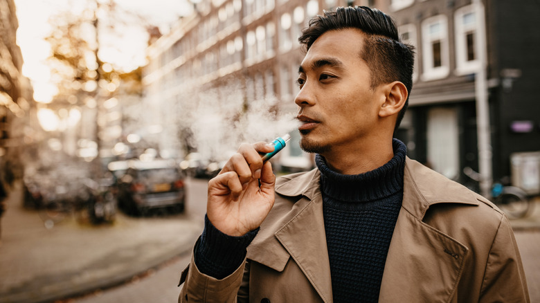 Man using electronic cigarette