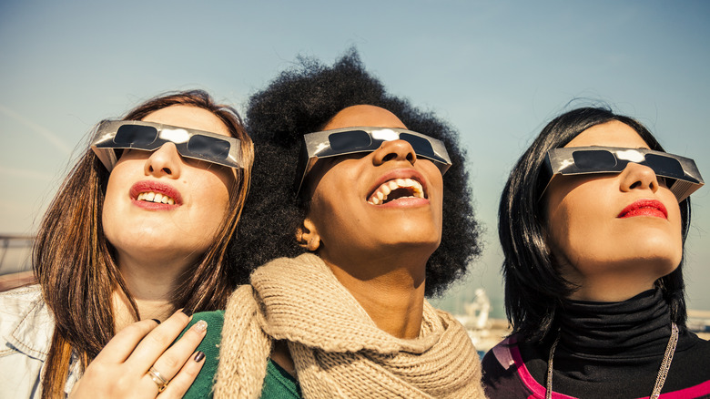 Friends looking at eclipse