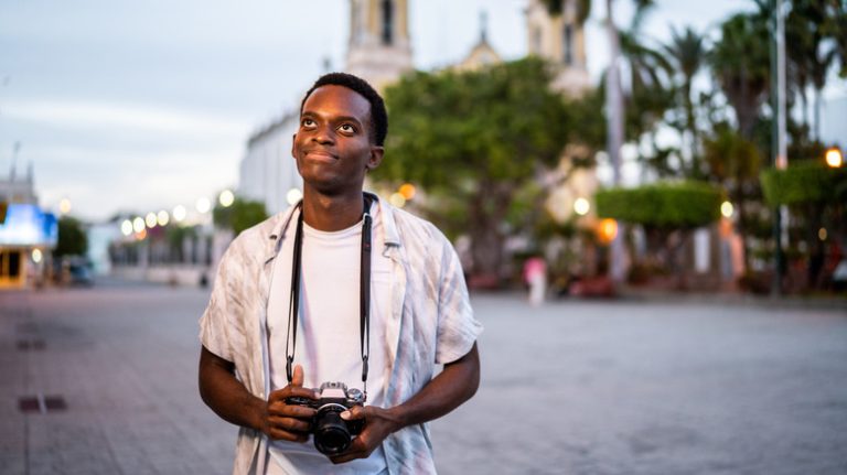 man alone with camera