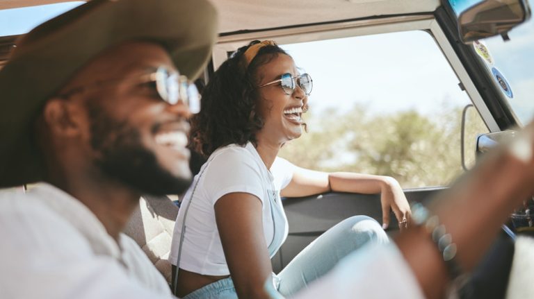 Happy couple during road trip