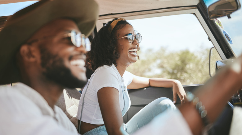 Happy couple during road trip