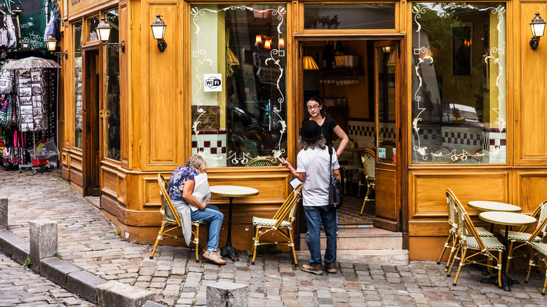 Customers talking to waitress