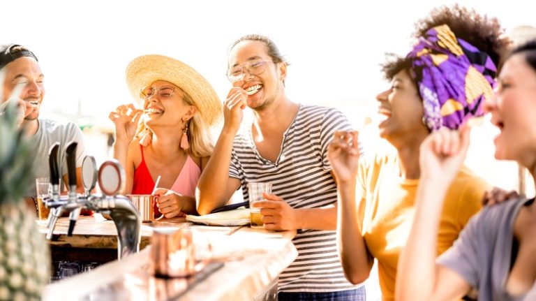 Friends sitting around bar