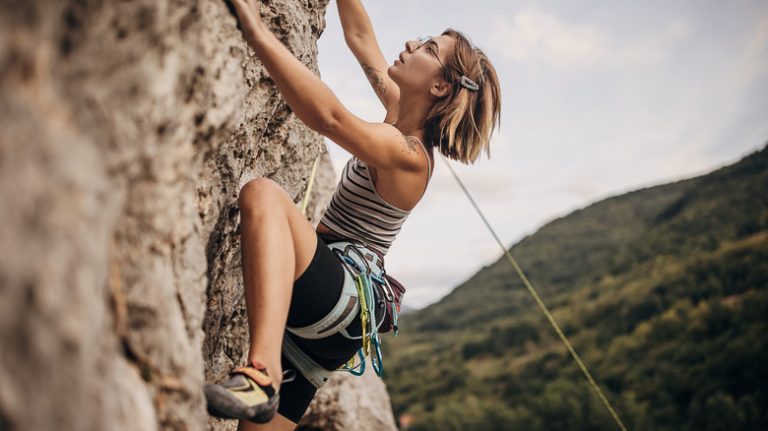 woman rock climbing