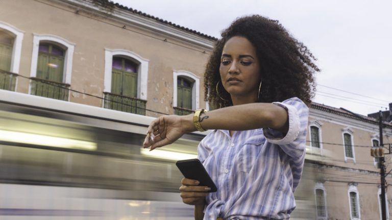 Stressed woman looking at watch