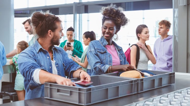 travelers in airport security