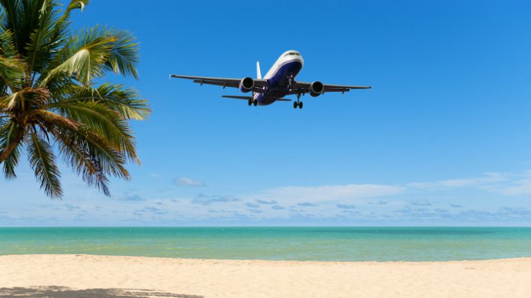 Plane landing near beach