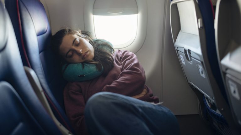 Woman sleeping on plane