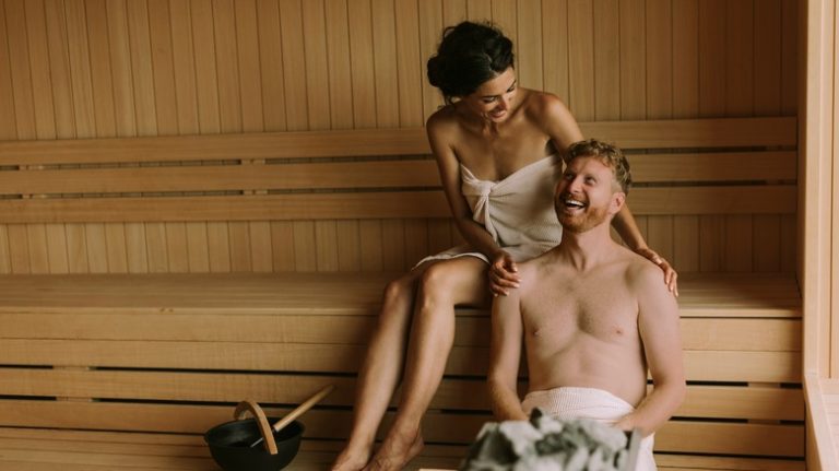 couple laughing in sauna