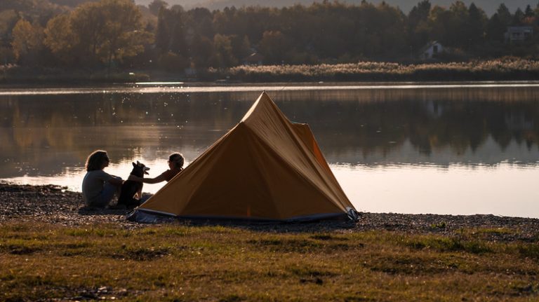 family camping beside river