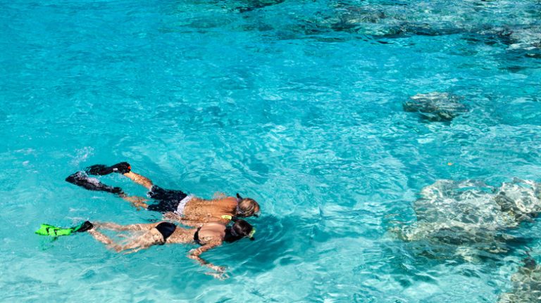 Couple snorkeling in Caribbean waters