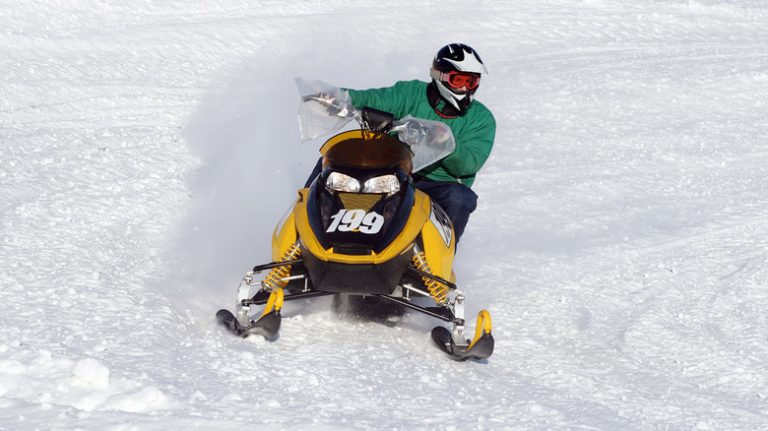 Snowmobiler making a turn