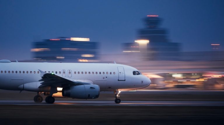 Plane speeding on the runway