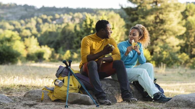 Couple resting on a rock