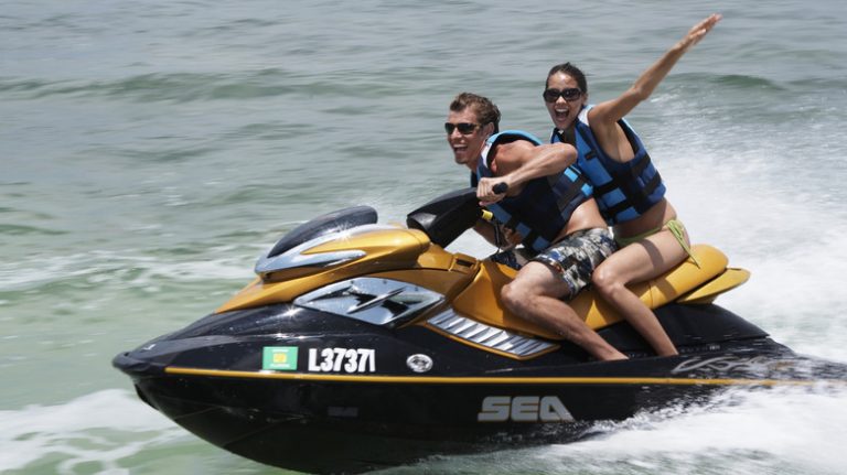 Couple jet skiing