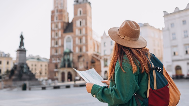 Female tourist using a map