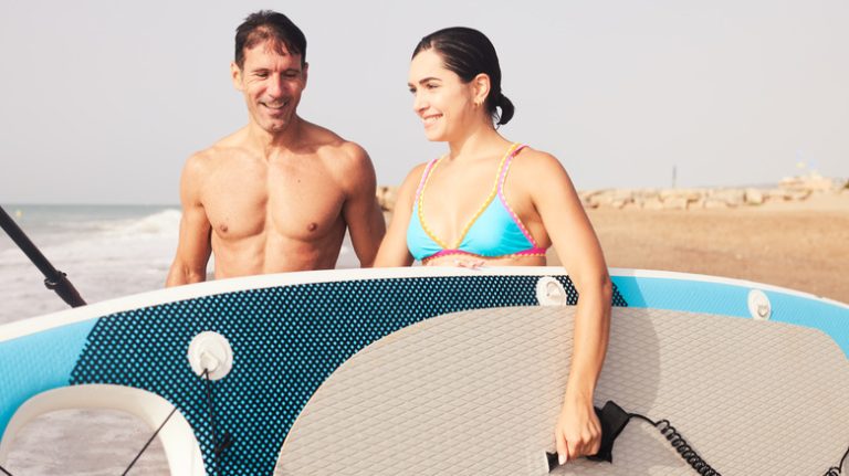 Couple with paddle board