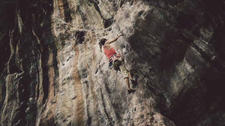 Climber on a Railay Beach karst