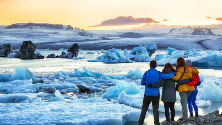 visitors standing on Jökulsárlón glacier