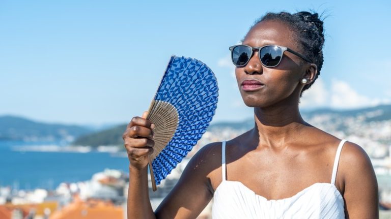 woman fanning herself