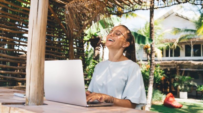 Woman smiling at computer