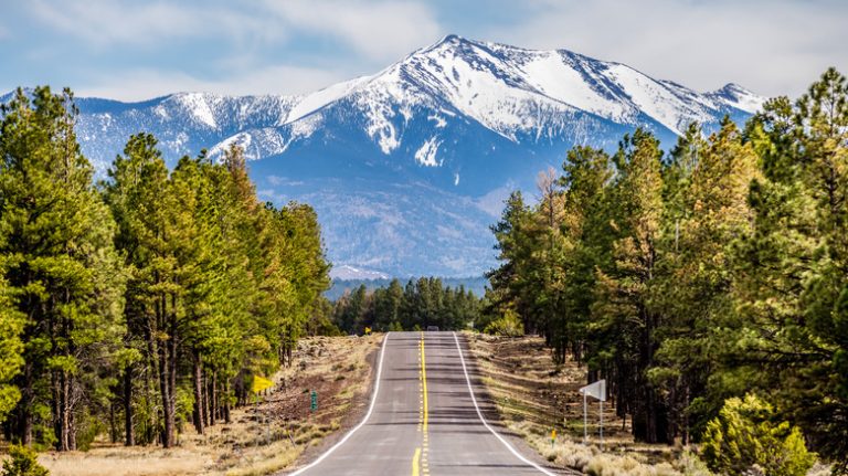 road leading toward tall mountain