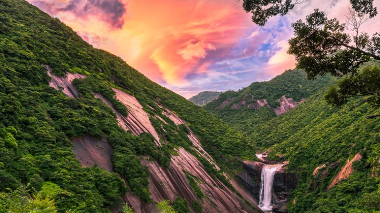 Yakushima mountainous waterfall at sunset