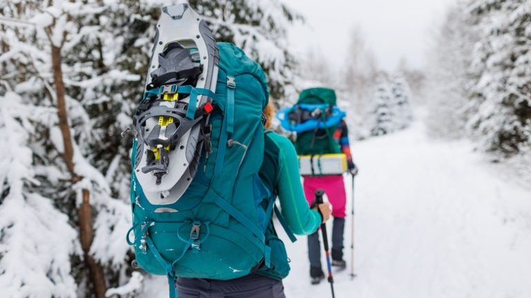 two people hiking in snow