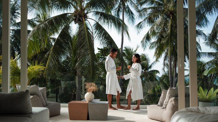 Couple standing on balcony