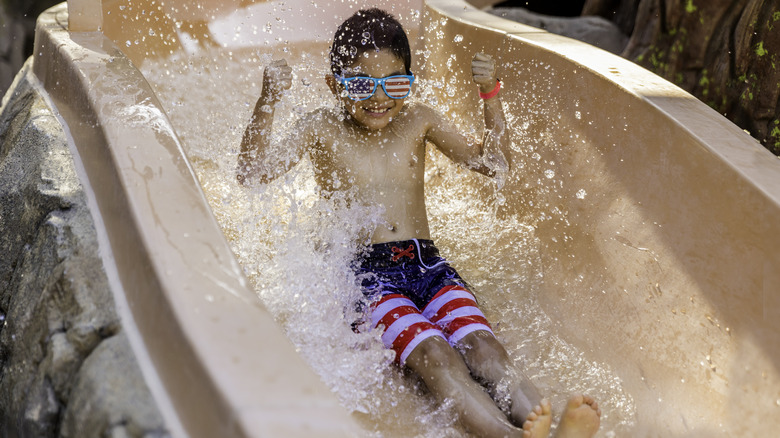 Child on a water slide