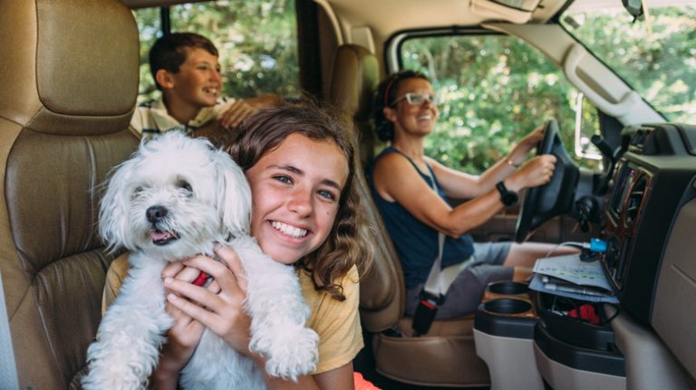 Family driving an RV