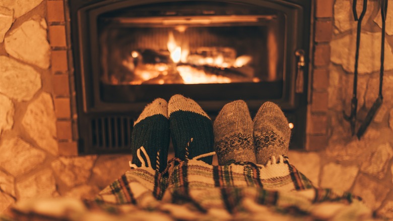 cozy couple by fireplace