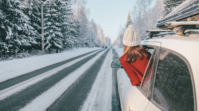 woman in car during snowstorm