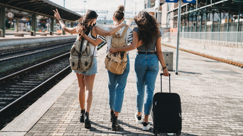 friends at a train station