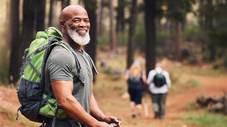 Man with a backpack in the woods