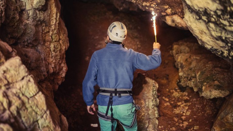 Man exploring a cave