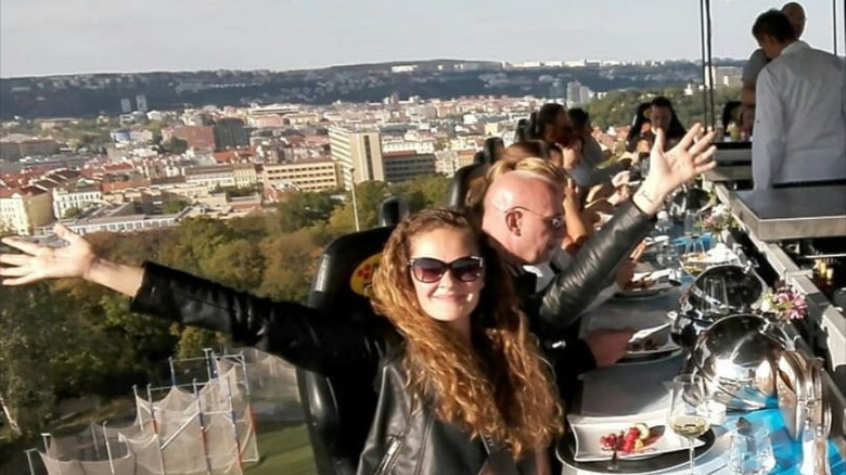 Female diner with Prague skyline