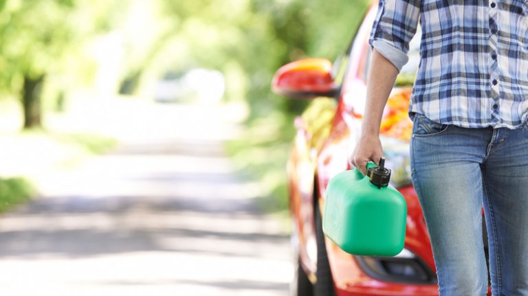 Person walking with gas can