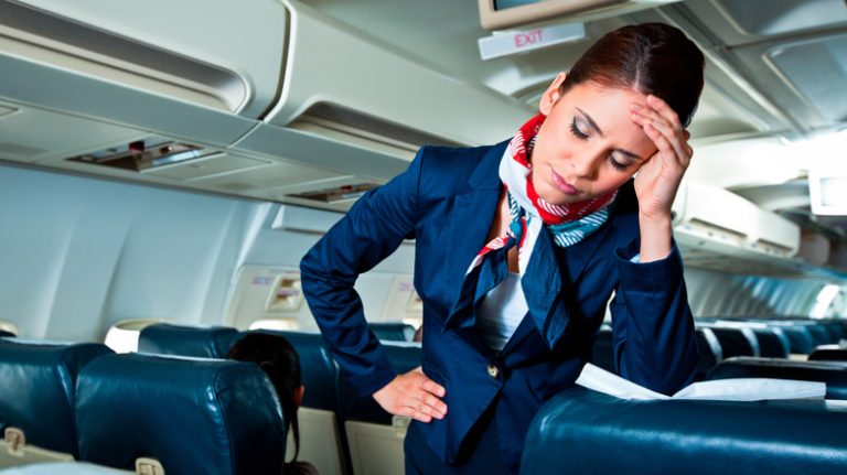 Annoyed flight attendant on plane