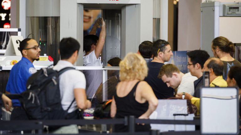 travelers at airport security checkpoint