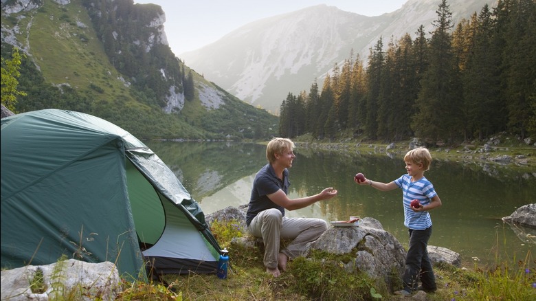 family camping by a lake