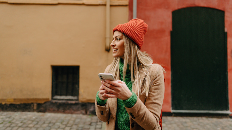 single female traveler with phone