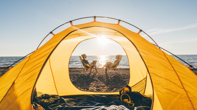 Tent campers by the water