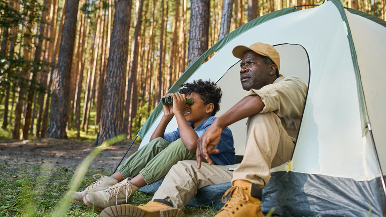 Father and son camping outdoors