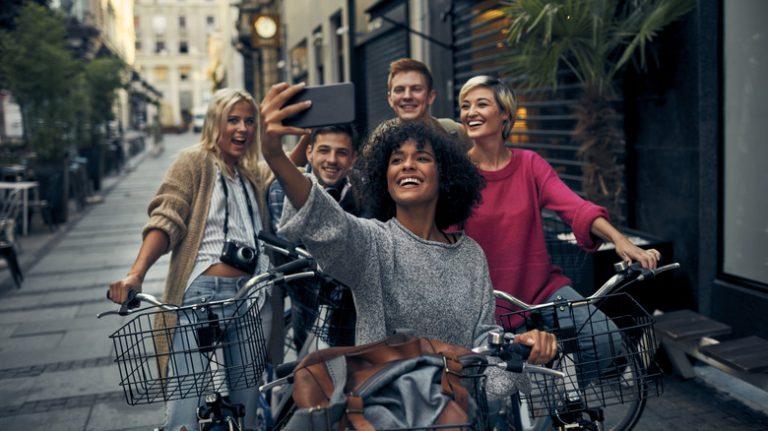 Friends on bikes taking a selfie