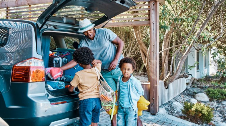 family packing car road trip