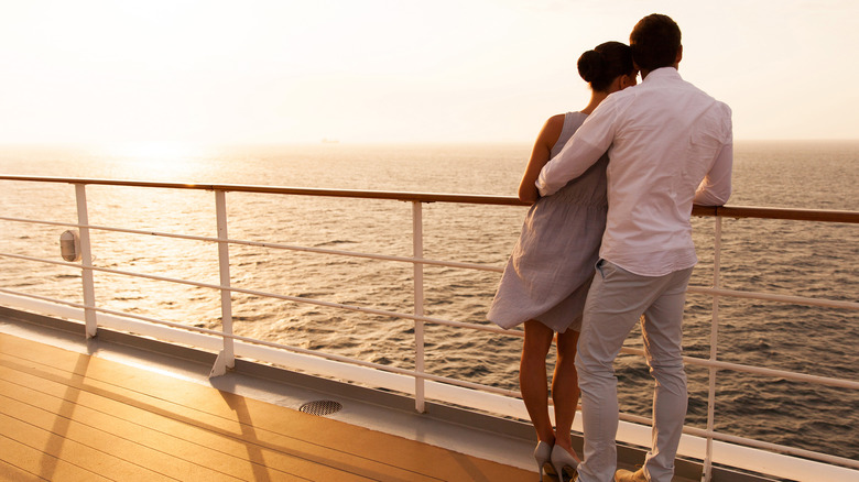 Couple cruising looking at sunset