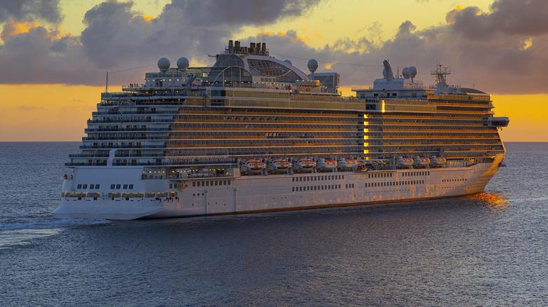 Cruise ship sailing at sunset