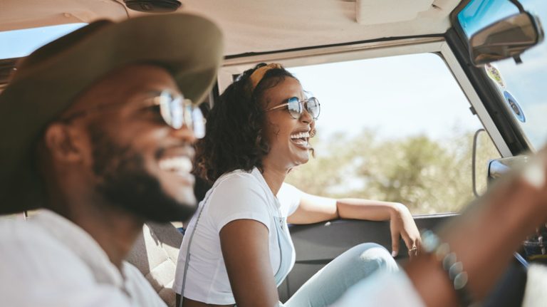 Couple driving on road trip